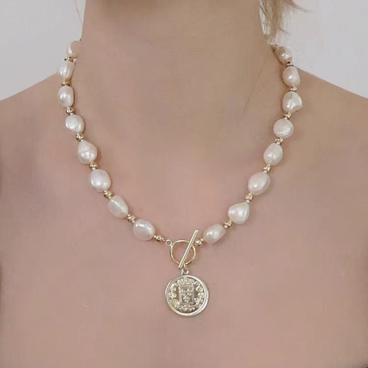 Styled Baroque Pearl Necklace With Gold Coin Pendant